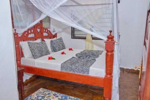 Postel nebo postele na pokoji v ubytování Hera Beachfront Apartment