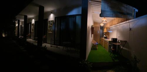 a hallway of a house with a table and chairs at Queens Villa in Seminyak