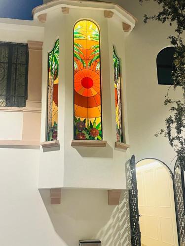 a stained glass window on the side of a house at Hotel Casa Ensenada Luxury Boutique Hotel in Mexico City