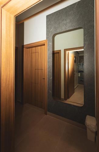 a bathroom with a mirror and a toilet at Zawaya watan in Nizwa