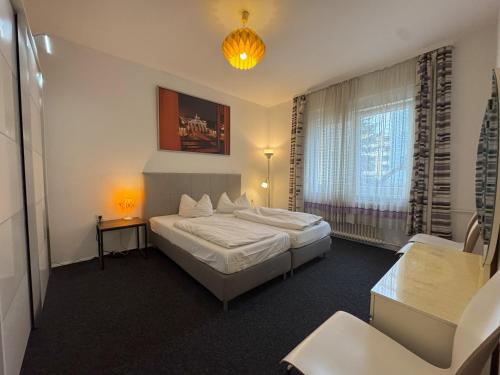 a hotel room with two beds and a window at M M Central Vintage Family, Handwerker und Monteure Apartments in Berlin