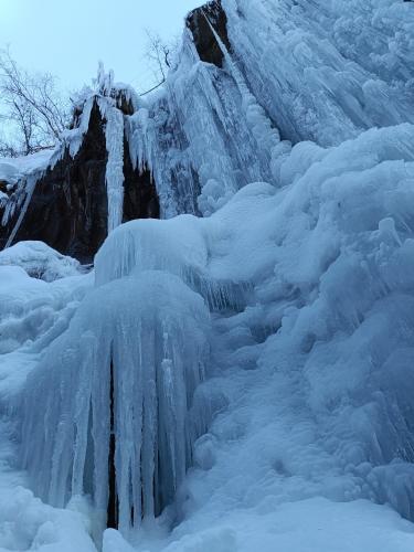 a large ice wall with snow on it at Ronalds Appartements in Sankt Leonhard im Pitztal