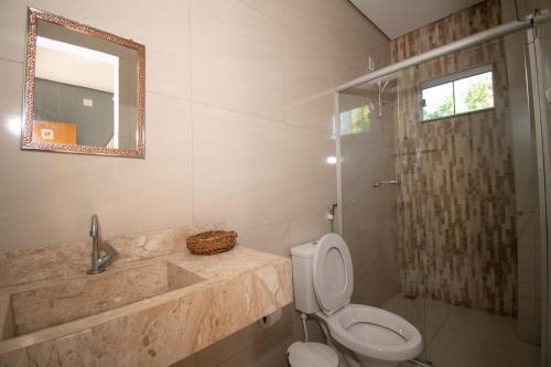 a bathroom with a sink and a toilet and a shower at Pousada Hotel Boutique Ventanas in Carolina