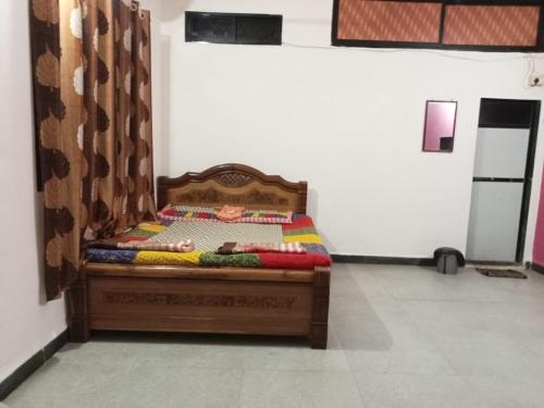 Ένα ή περισσότερα κρεβάτια σε δωμάτιο στο Sai Sneh Holidays Cottage