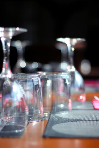 a group of glasses sitting on a table at Ô Villagio Hôtel in Villeneuve-Loubet