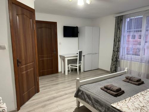 TV a/nebo společenská místnost v ubytování Harmony
