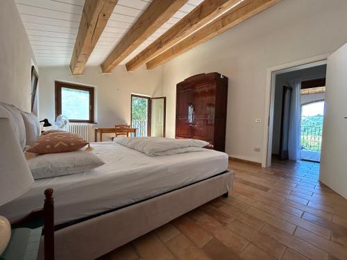 Ένα ή περισσότερα κρεβάτια σε δωμάτιο στο Casa Petritoli