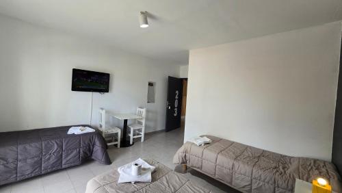 a living room with a couch and a table at Vida, hotel de playa in Puerto Madryn