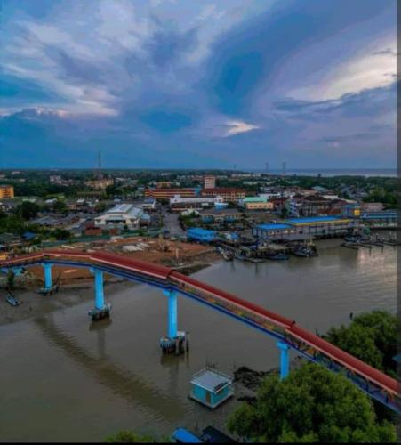 a train on a bridge over a river at Village Retreat Jetty Kuala Perlis in Kuala Perlis