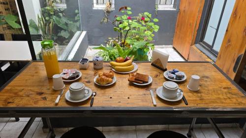 a table with breakfast food on top of it at Vida, hotel de playa in Puerto Madryn
