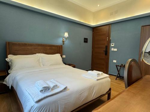 Postel nebo postele na pokoji v ubytování Modi Hotel