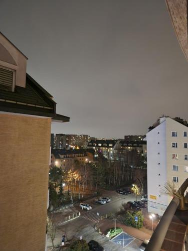a view of a parking lot in a city at night at New! Warsaw Luxury Apartment with Jacuzzi and total relax - Warszawski Luksus Jacuzzi i totalny relaks! in Warsaw