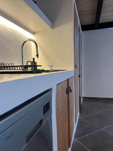 a kitchen with a sink and a counter at Evas Urban loft 1 CLOSE TO PYTHAGOREIO in Chóra