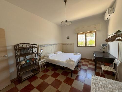 Una cama o camas en una habitación de Villa Odetta - appartamento Est