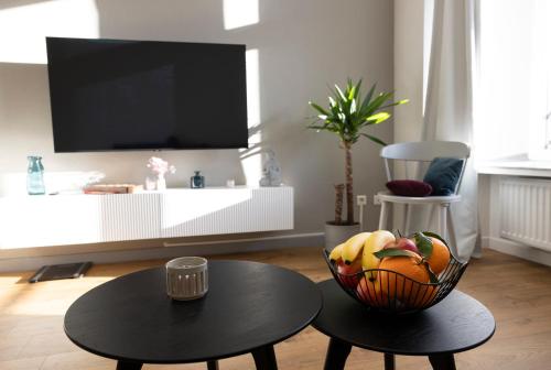 Μια τηλεόραση ή/και κέντρο ψυχαγωγίας στο FID B' Home, appartement Cosy entre Mulhouse et Colmar