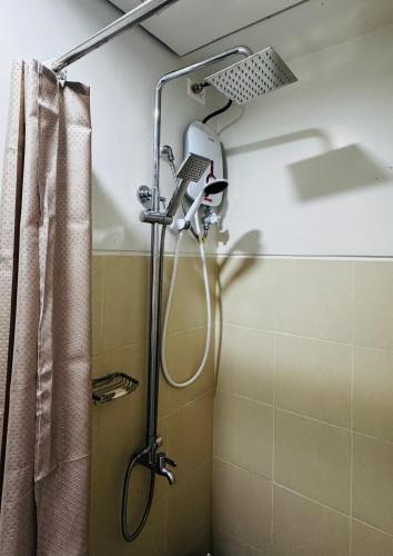 Vonios kambarys apgyvendinimo įstaigoje SMDC Style Residences
