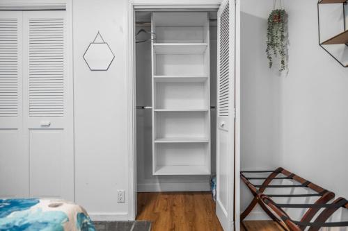 a closet with empty shelves in a room at Private & Convenient-Hot tub-Fire Pit-Game room! in Petoskey