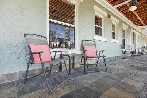 two chairs and a table on a patio at Sunshine-Shopping-Dining In the heart of Downtown in St Petersburg
