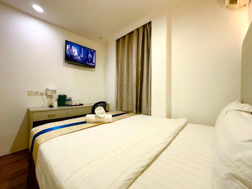 Ένα ή περισσότερα κρεβάτια σε δωμάτιο στο Park Hotel