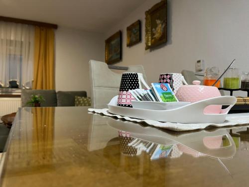 a table with a tray on top of a table at Apartman House Jasmina in Bihać