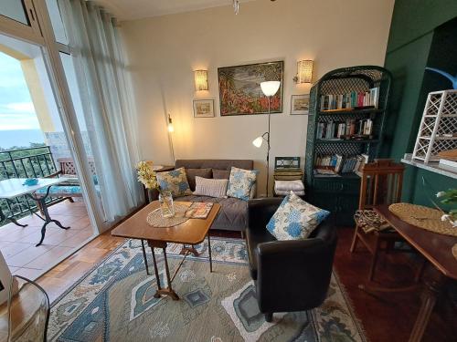 a living room with a couch and a table at Apartment Palma Madeira wandern und tauchen in Caniço