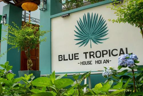 a sign for a blue tropical house halo inn at Blue Tropical House Hội An in Hoi An