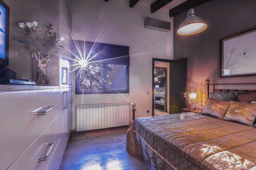 a bedroom with a large bed in a room at Villa Palmera in Olivella
