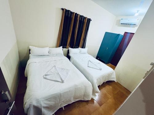 Postel nebo postele na pokoji v ubytování CBS 2Bhk Villa