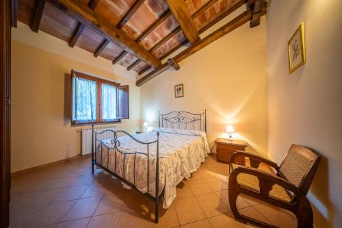 Ένα ή περισσότερα κρεβάτια σε δωμάτιο στο Agriturismo L'Elce