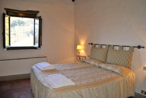 Ένα ή περισσότερα κρεβάτια σε δωμάτιο στο Agriturismo Il Giardino