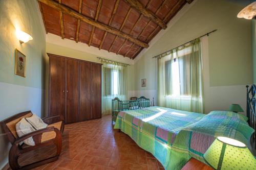 Ένα ή περισσότερα κρεβάτια σε δωμάτιο στο Agriturismo L'Elce