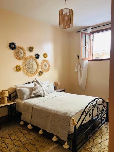 Ένα ή περισσότερα κρεβάτια σε δωμάτιο στο Appartement a 4 Minutes de la plage
