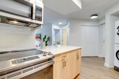 a kitchen with a sink and a stove at Spacious and Minimalist Apartment w Awesome Facilities in Arlington