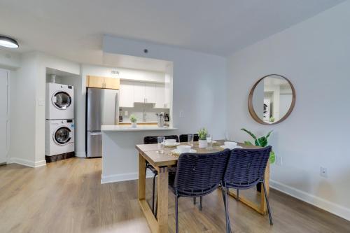 a kitchen and dining room with a table and chairs at Spacious and Minimalist Apartment w Awesome Facilities in Arlington