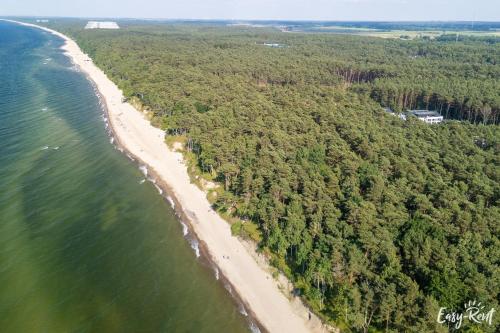 an aerial view of a beach and the ocean at K&K Apartment - Premium z basenem - SeaShell - Easy - Rent Apartments in Łukęcin