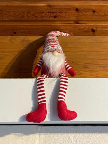 a stuffed animal wearing red and white striped socks at Bulle ivoire in Hastière-par-delà