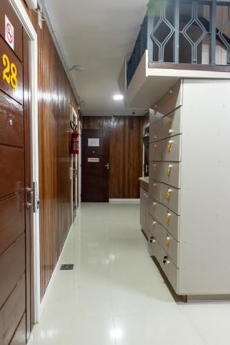 a room with a closet with a dresser and a staircase at Dalmo Hotel in Gravatal