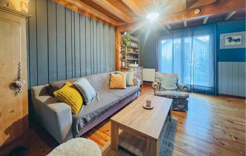 a living room with a couch and a coffee table at Lovely Home In Langatte With Wifi in Langatte