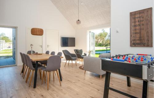 a dining room with a table and a giant chessboard at Beautiful Home In Rømø With Wifi in Kongsmark