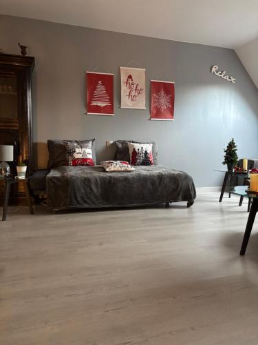 a bedroom with a large bed in a room at Gite le Patis in Pré-en-Pail