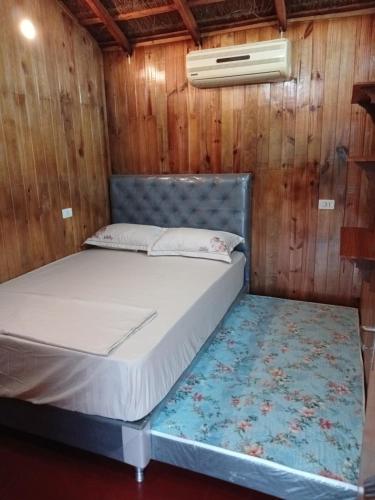 Postel nebo postele na pokoji v ubytování Cabañas Compartidas en Casa Quinta en Itá