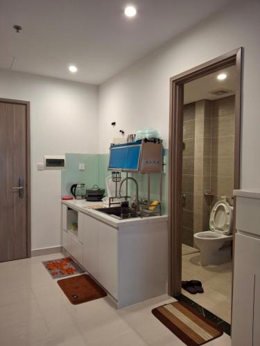 a kitchen with a sink and a toilet at Vinhomes Grand Park in Long Bình