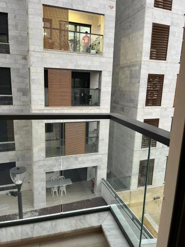 a view of a building with a glass balcony at Boutique Nesher in Nesher