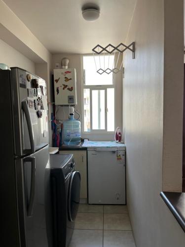 Kuchyň nebo kuchyňský kout v ubytování Acogedor departamento en La Serena
