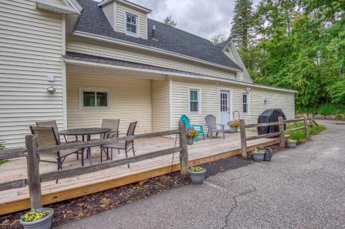 a porch of a house with a table and chairs at Studio - Adventure Property in Whitefield