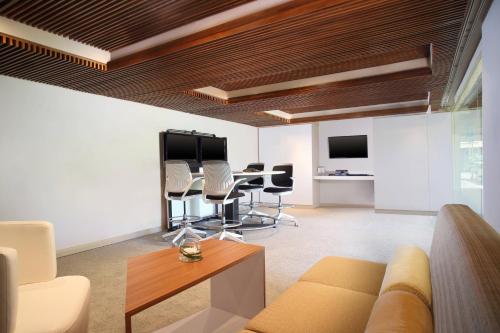 a living room with a couch and a table and chairs at The Westin Resort Nusa Dua, Bali in Nusa Dua