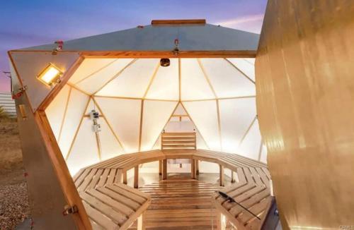 a room with two chairs in a glass dome at Beyond - Walk to Red Dog & Pappy's in Pioneertown