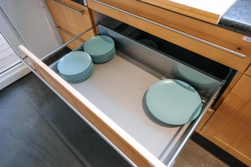 two toilets sitting on a shelf in a kitchen at Le LOFT de la Route des Vins in Guebwiller