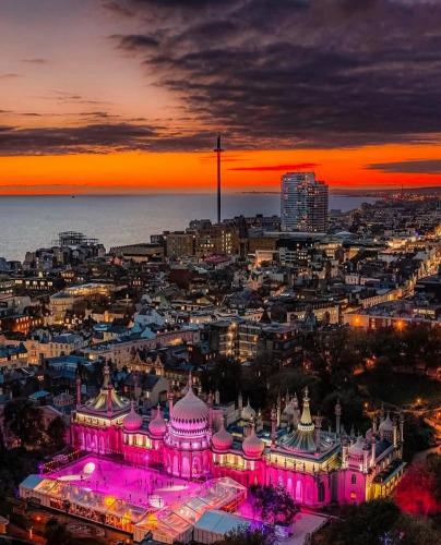 a city with a building lit up at night at The Boat View - Sea View - Tiny home Brighton Marina in Brighton & Hove