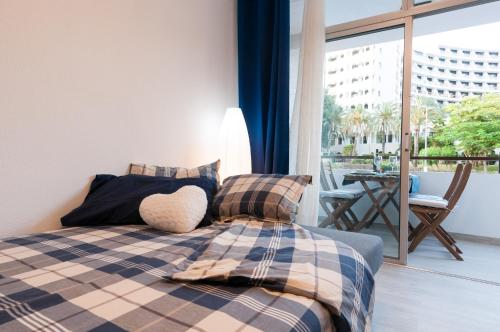 En eller flere senge i et værelse på Prosurfing Apartamento